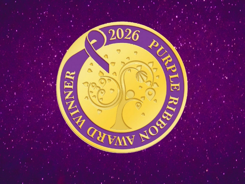 2026 Purple Ribbon Award medallion on a glittery purple background.